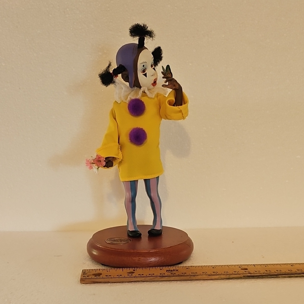 Yellow and Purple Clown Figurine
